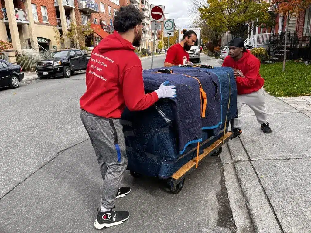 movers moving an appliance